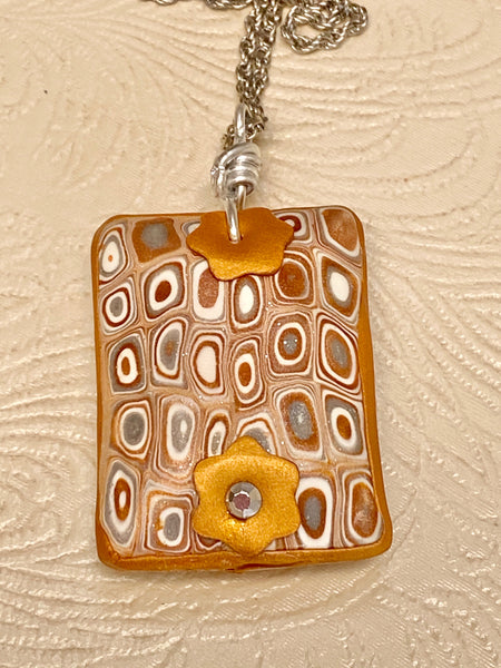 Clay Puffed Pendant with Gold, Silver and White Pattern Necklace